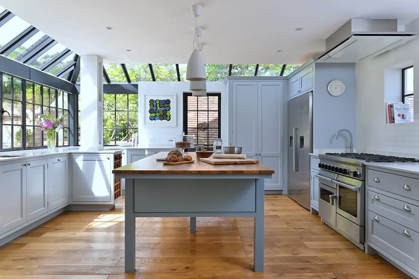 Hand-painted in-frame traditional kitchen with a floating island